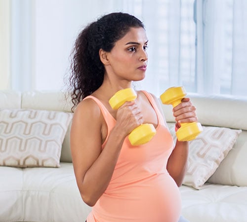 Pregnant couple doing yoga